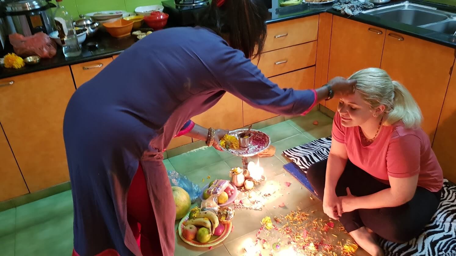 Amy Falzo putting Nepali Tika