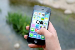 iPhone in hand